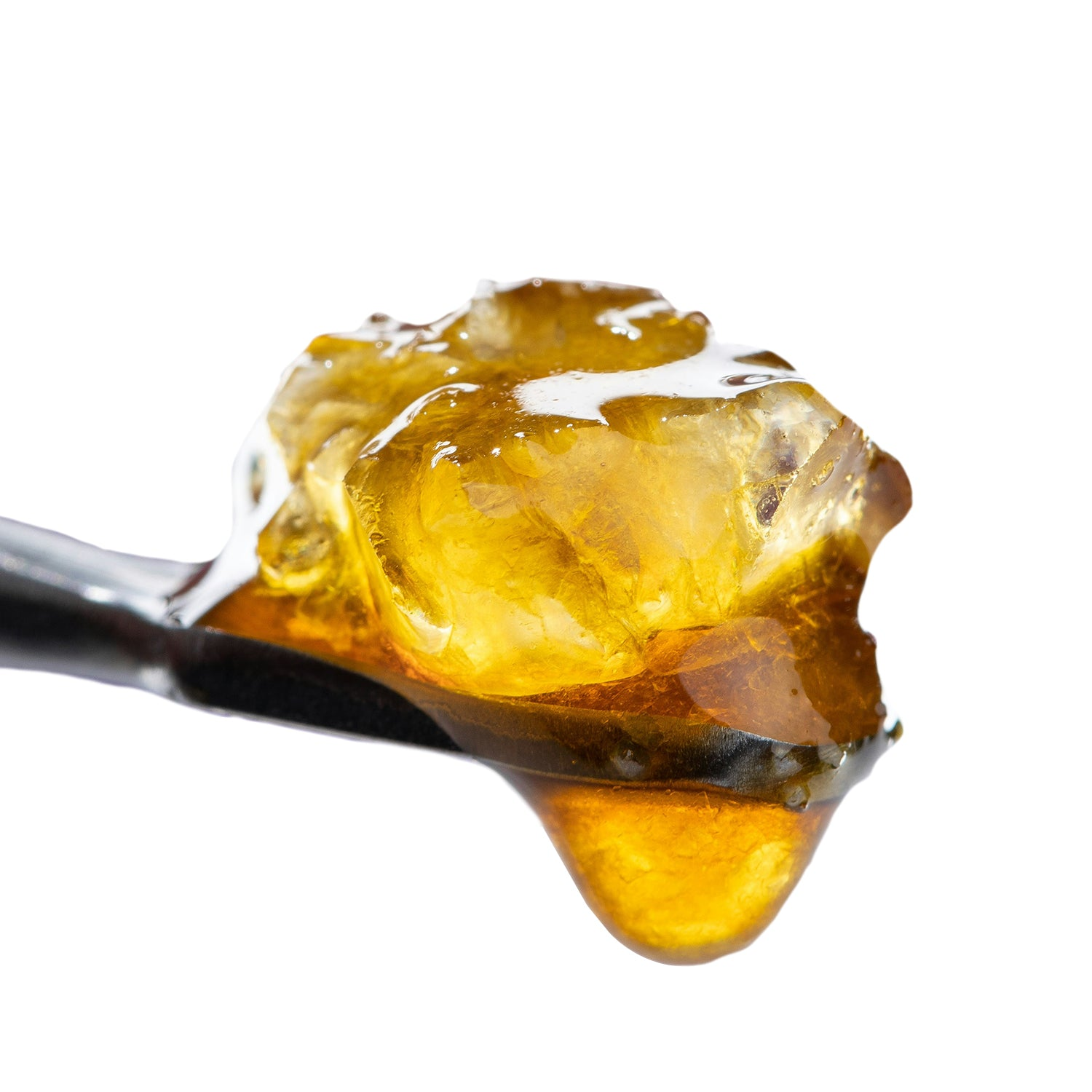 Close-up of sparkling cannabis THCA diamonds on a white background.