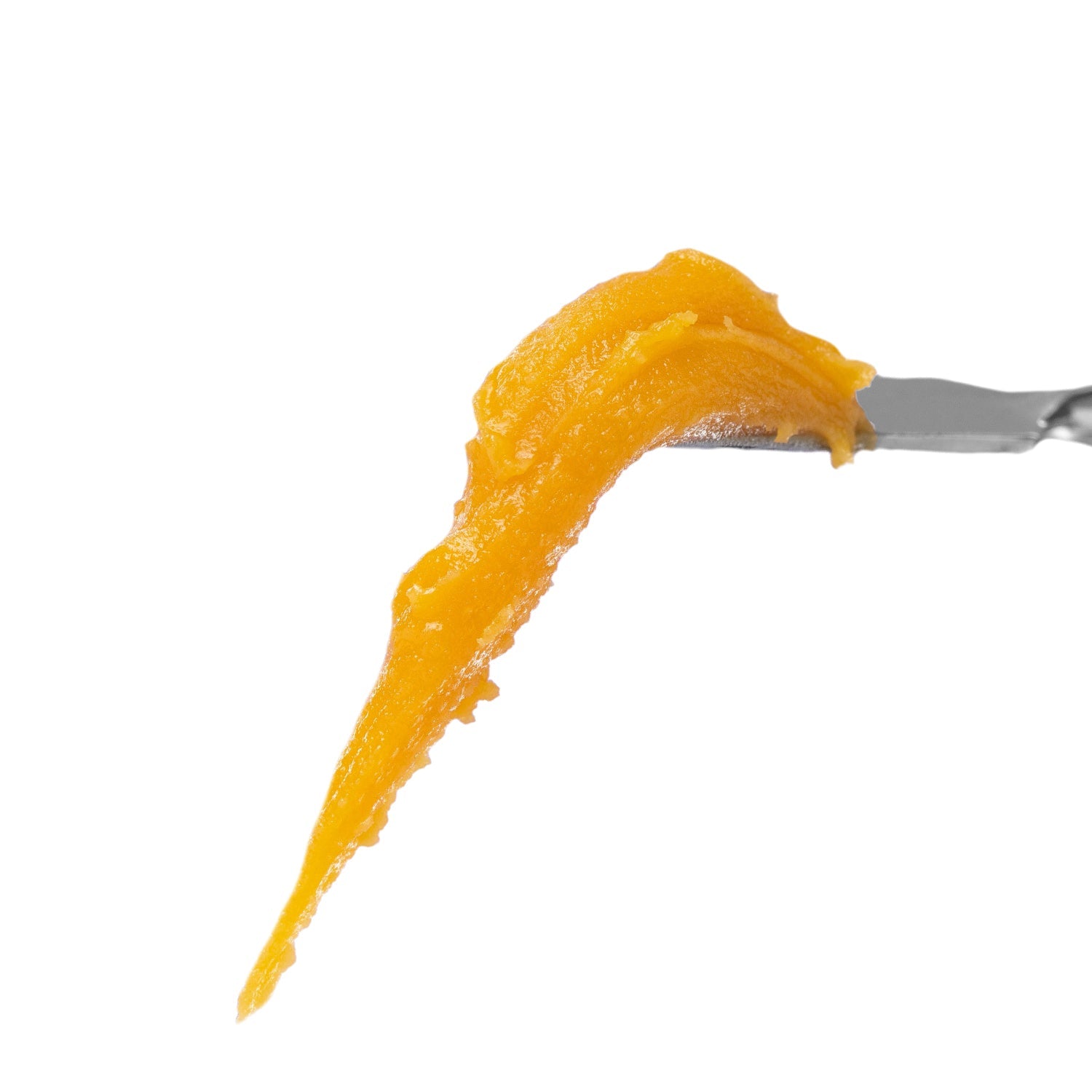 Golden cannabis resin concentrate dripping, highlighting rich texture and potency.